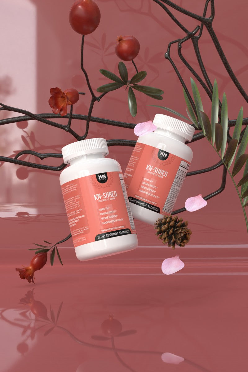 KN-Shred fat burner supplement bottles showcased against a natural background, emphasizing the product's blend of natural ingredients designed to aid weight loss without caffeine-induced jitters.